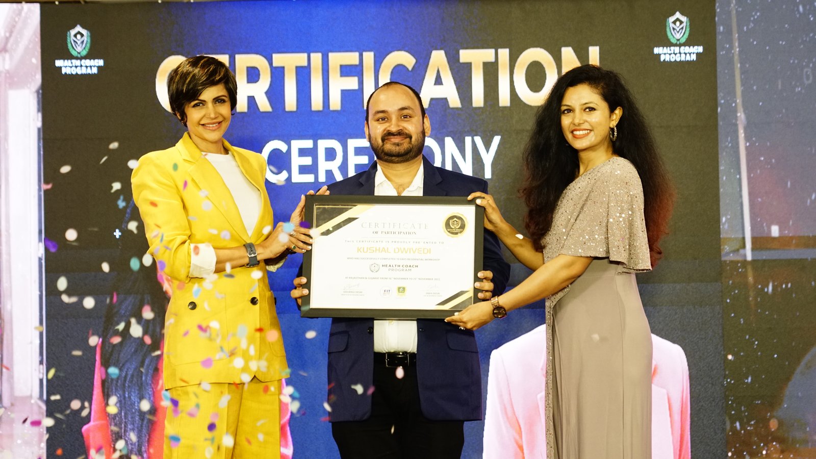 Kushal Dwivedi receiving the Significant Contributor award, with Mandira Bedi